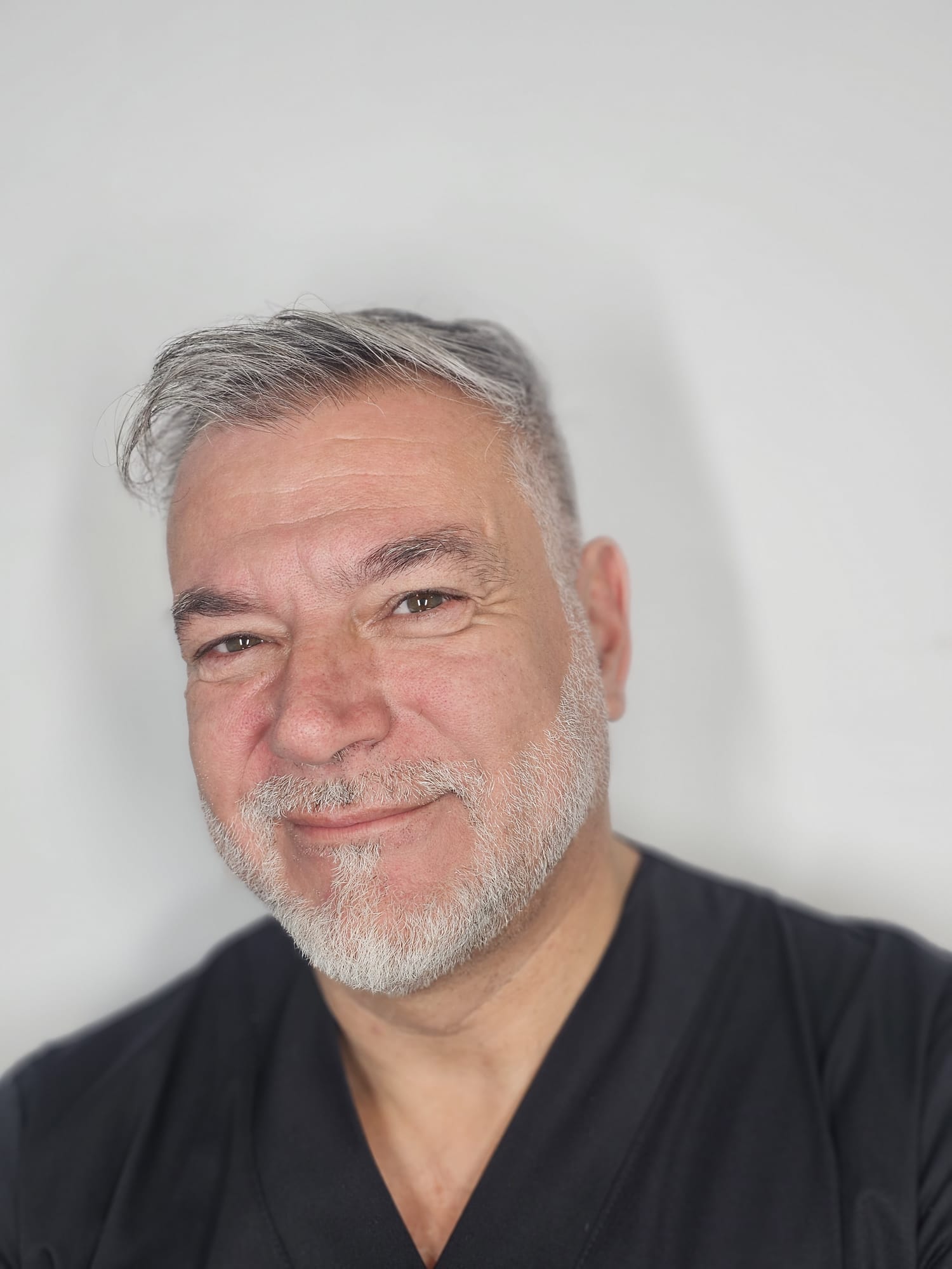 A professional analyzing data on a tablet.